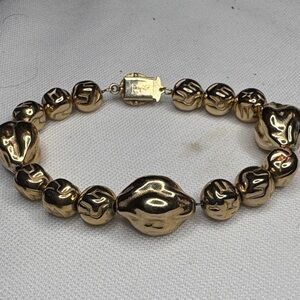 Elegant Gold Beaded Bracelet by Judy Lee.